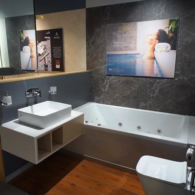 Bathtub styled with marble wall and decor